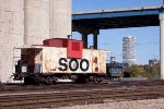 Neutered caboose 138, formerly tethered to Soo crane 751203, was downgraded to shoving platform